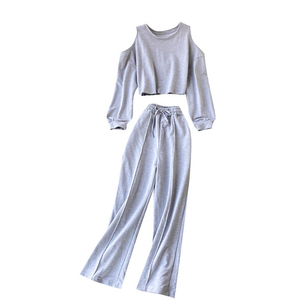 Naiste vabaaja komplekt, mis sisaldab paljaste õlgadega pluusi ja laia pükse