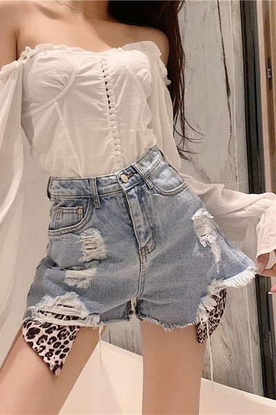 Stiilsed loomamustri ja rebenenud motiividega naiste lühikesed püksid