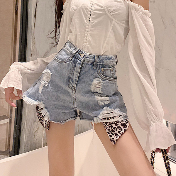 Stiilsed loomamustri ja rebenenud motiividega naiste lühikesed püksid