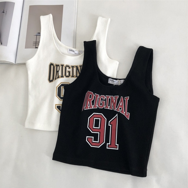 Aktuális női felső, széles pántokkal és rátéttel