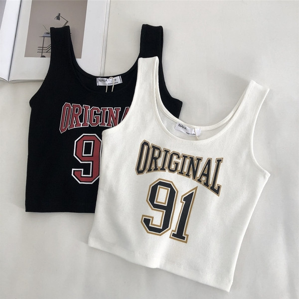 Aktuális női felső, széles pántokkal és rátéttel