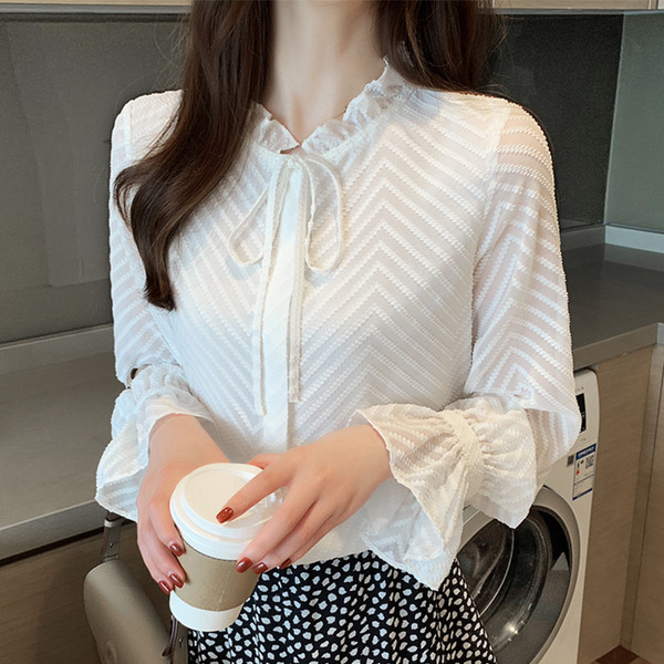 Stiilne valge paela ja pikkade varrukatega naiste särk