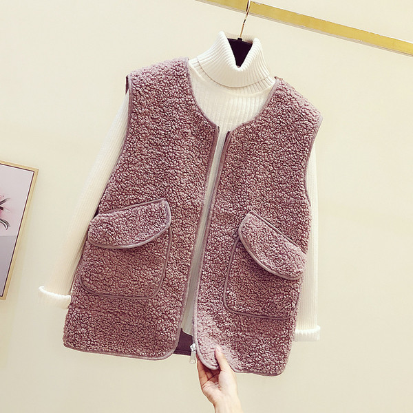 Női pehelymellény cipzárral és zsebekkel