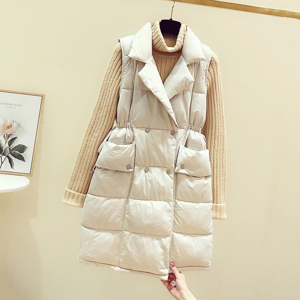 Hosszú női mellény cipzárral és zsebekkel