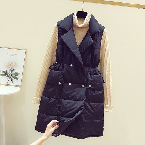 Hosszú női mellény cipzárral és zsebekkel