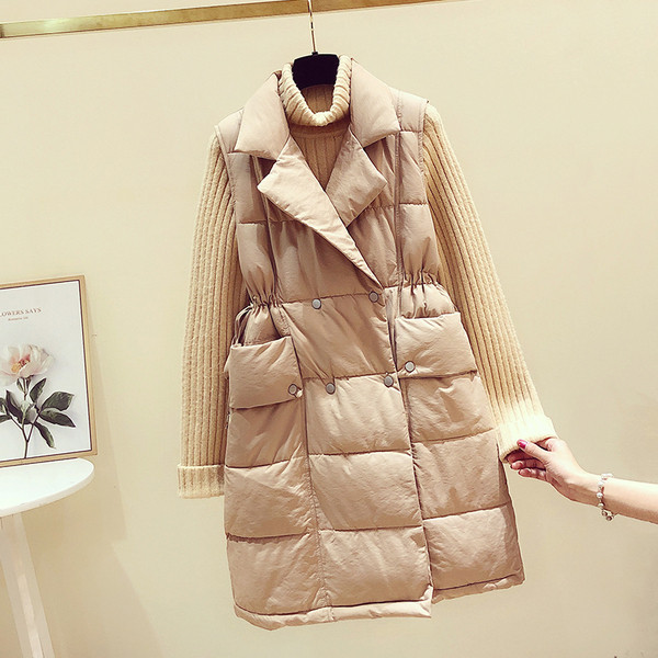 Hosszú női mellény cipzárral és zsebekkel