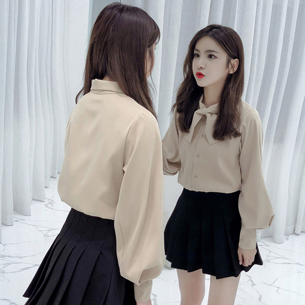 Stilīgs sieviešu krekls ar lenti un platām piedurknēm