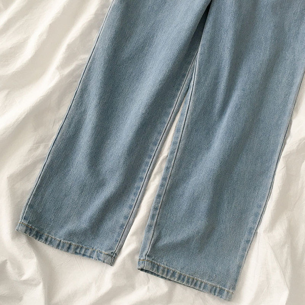 Naiste peenikeste rihmade ja lipsudega teksakombinesoon