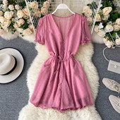 Modern női overall spitz nyakkivágással és nyakkendővel