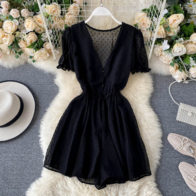 Modern női overall spitz nyakkivágással és nyakkendővel