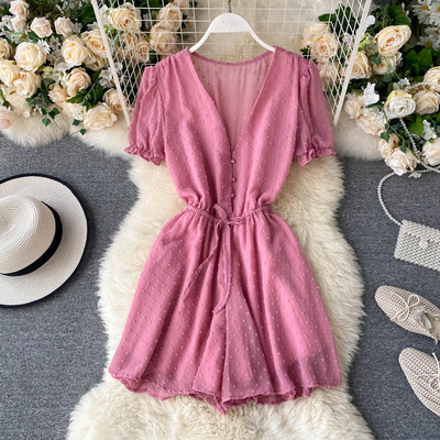 Modern női overall spitz nyakkivágással és nyakkendővel