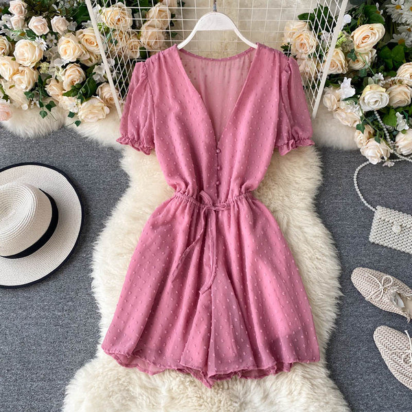 Modern női overall spitz nyakkivágással és nyakkendővel