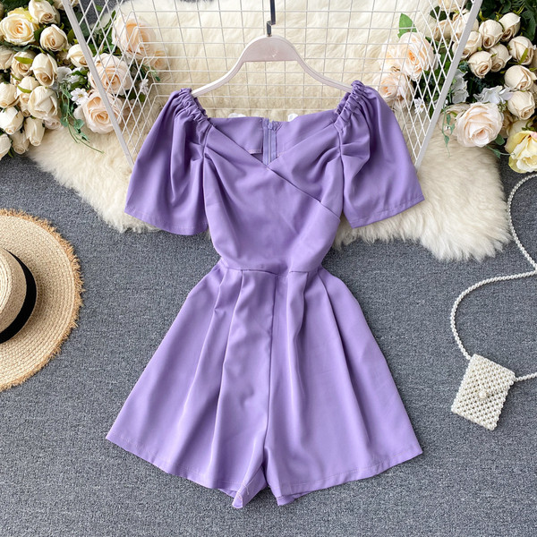 Modern női overall spitz nyakkivágással és cipzárral