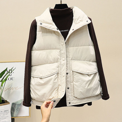 Valge ja musta värvi nööpide ja lukuga naiste vest