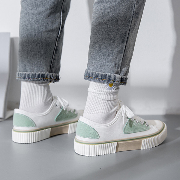 Fűzős, lapos talpú női textil tornacipő