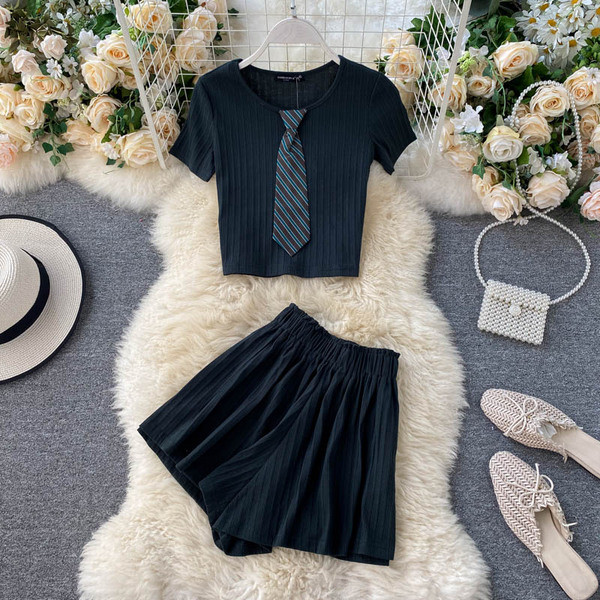 Plisseeritud naiste komplekt pluusist ja kõrge vöökohaga pükstest