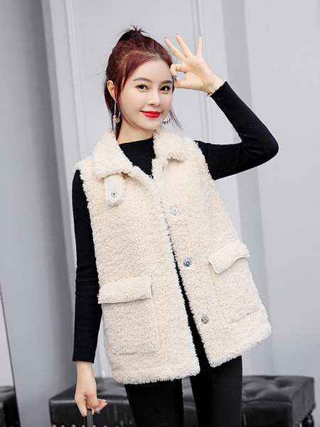 Jelenlegi női mellény zsebekkel, gombokkal