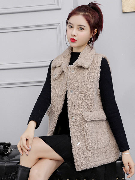 Jelenlegi női mellény zsebekkel, gombokkal