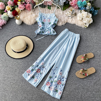 Stiilne naiste topi ja pikkade lillemustriga pükste komplekt