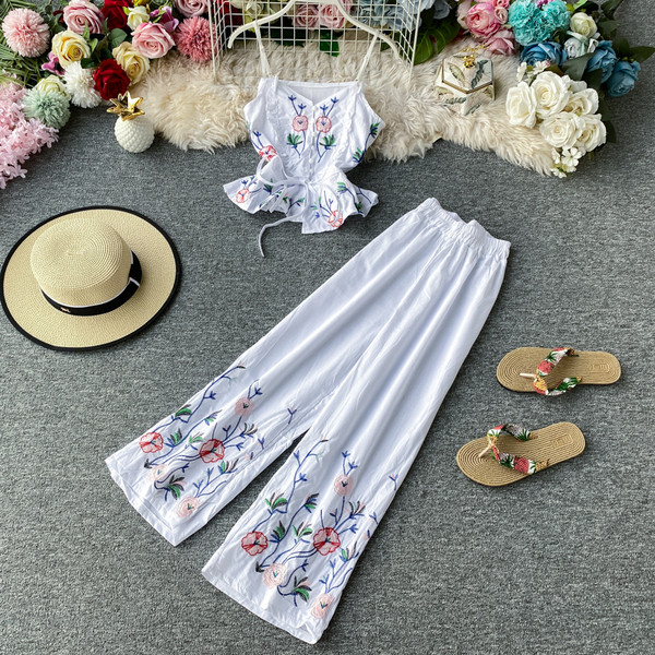 Stiilne naiste topi ja pikkade lillemustriga pükste komplekt