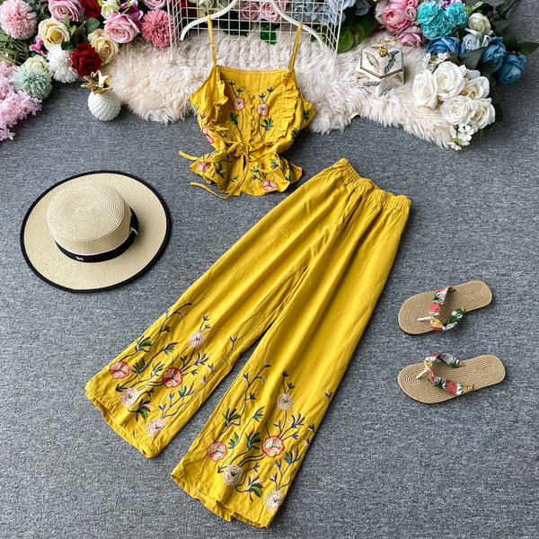 Stiilne naiste topi ja pikkade lillemustriga pükste komplekt