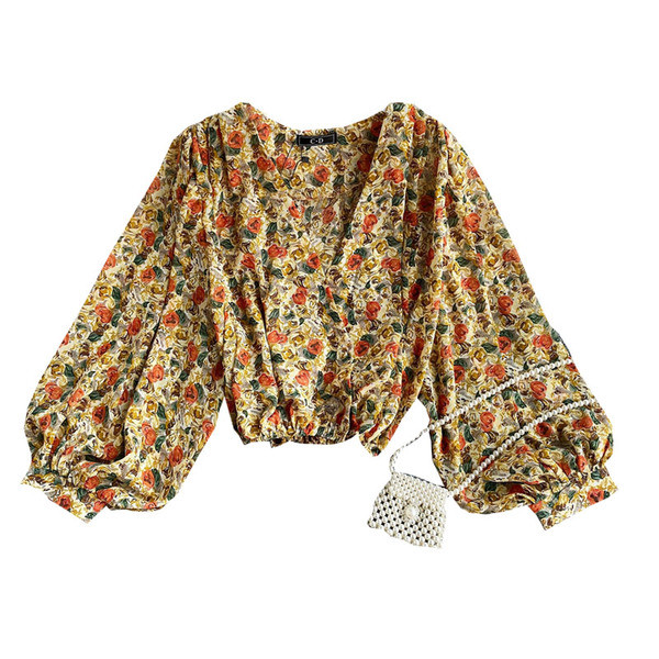 Lillemustri ja laiade varrukatega naiste moodne särk