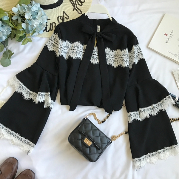 Modern női ing széles ujjal és gallérral szalaggal