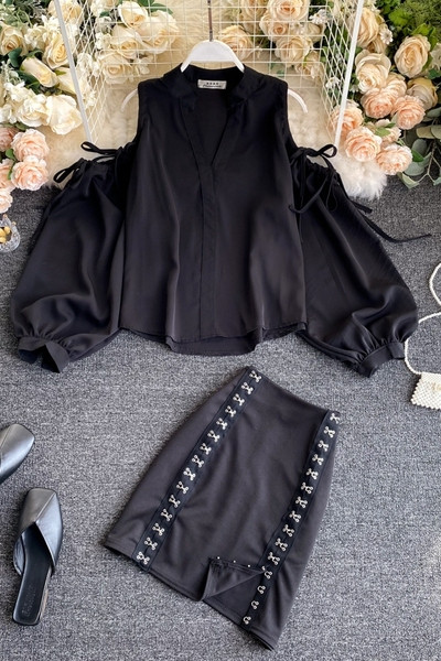 Fekete női szoknya és ing szett csupasz váll