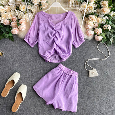 Naiste pluusikomplekt, mille esiosa ja püksid on kokkutõmmatud