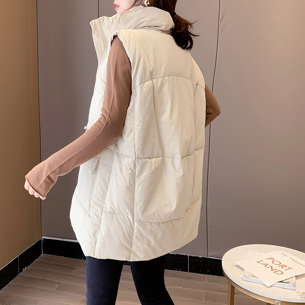 Kõrge krae ja taskutega vabaaja naistevest