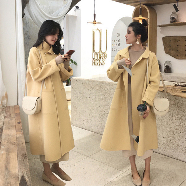 Pikk naiste mantel taskute ja nööpidega