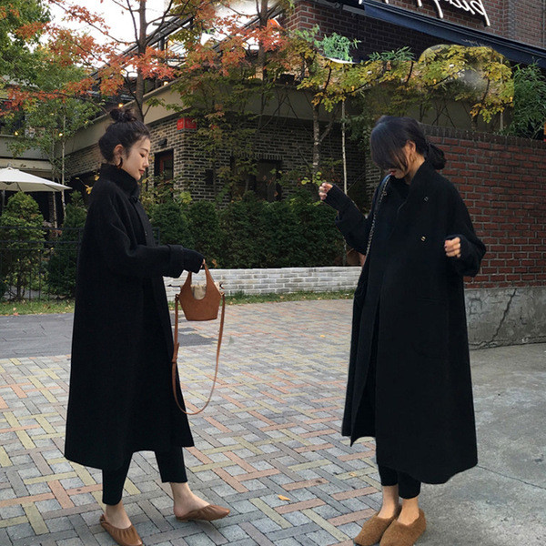 Pikk naiste mantel taskute ja nööpidega