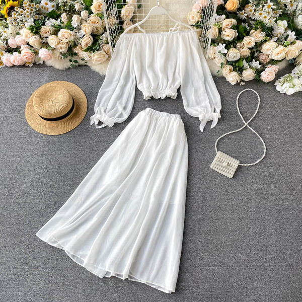 Valge naiste pluusi ja pika seeliku komplekt