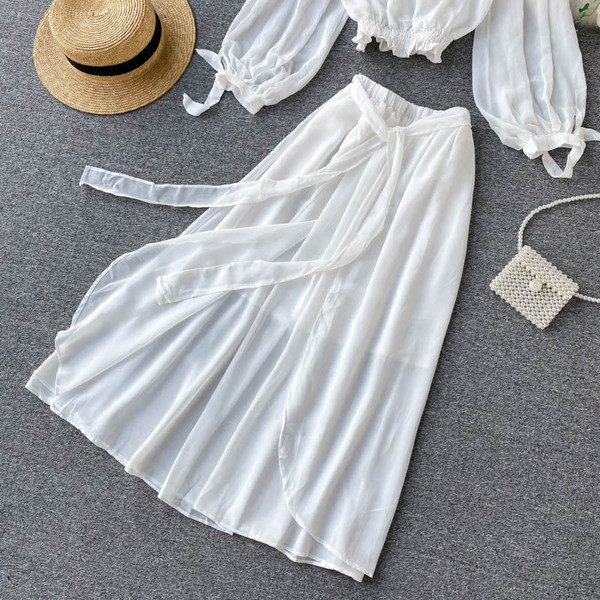 Valge naiste pluusi ja pika seeliku komplekt