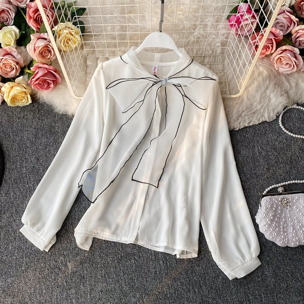 Elegantna bijela ženska košulja s dugim rukavima i trakom