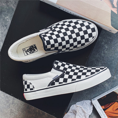 Must-valged meeste tekstiilist mokassiinid