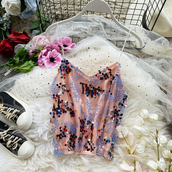 Modern női felső vékony pántokkal és flitterekkel