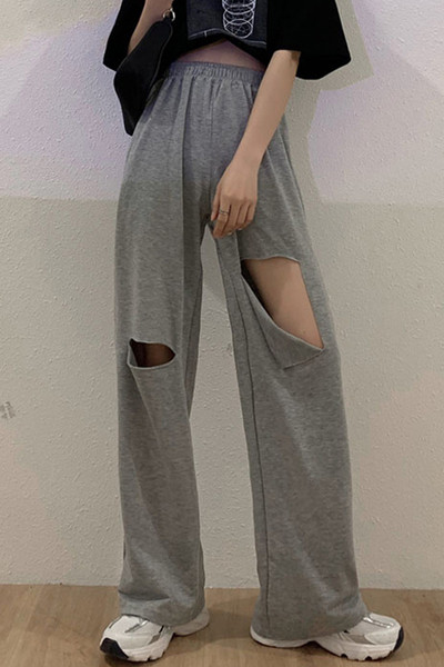 Női alkalmi nadrág magas derékkal, szakadt motívumokkal