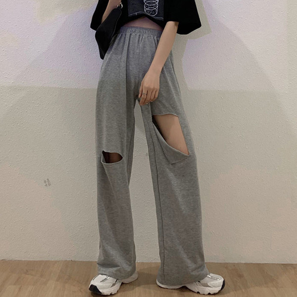 Női alkalmi nadrág magas derékkal, szakadt motívumokkal