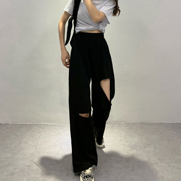 Női alkalmi nadrág magas derékkal, szakadt motívumokkal