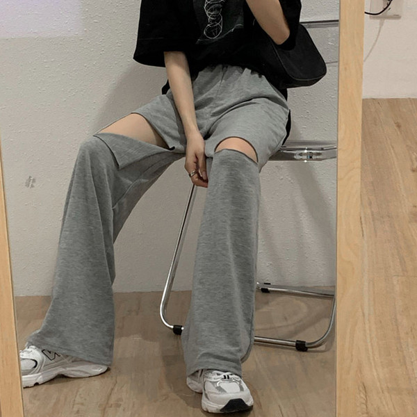 Női alkalmi nadrág magas derékkal, szakadt motívumokkal