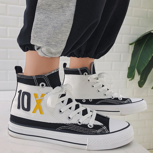 Magas modell vászon tornacipő feliratokkal