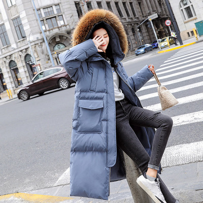 Modern női téli hosszú kabát mély zsebekkel és pehellyel