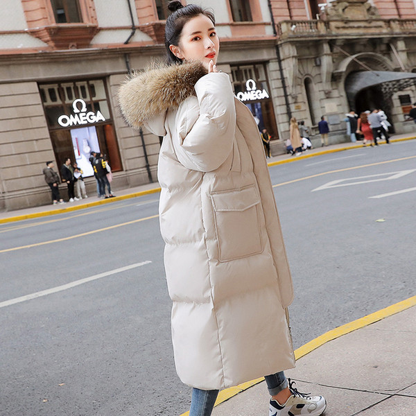 Modern női téli hosszú kabát mély zsebekkel és pehellyel