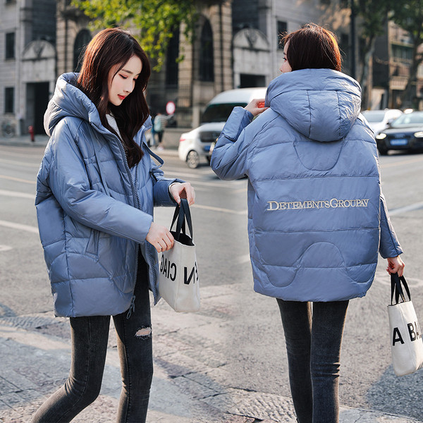 Női téli kabát széles modell kapucnival