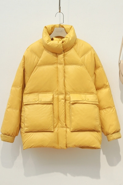 Női alkalmi kabát kerek nyakkivágással és zsebekkel