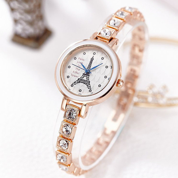 Női karóra kövekkel és fém szíjjal