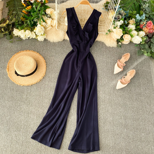 Hosszú női jumpsuit V-nyakkal és fürtökkel