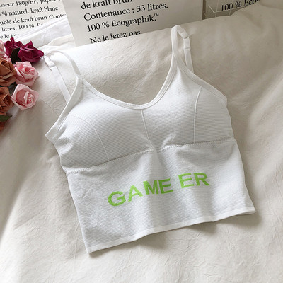 Tikandite ja õhukeste rihmadega naiste topp