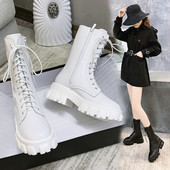 Nahast naiste saapad paelte ja krobelise tallaga